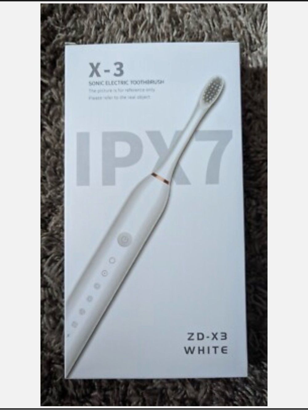 Matoen model X-3 Sonic Electric Toothbrush in white.